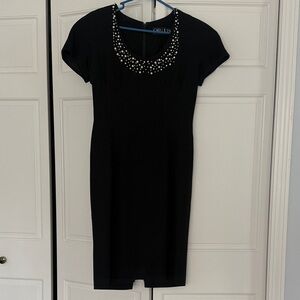 Elegant Black Dress with Embellished Neckline
